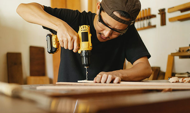 Man wotking in woodworking workshop